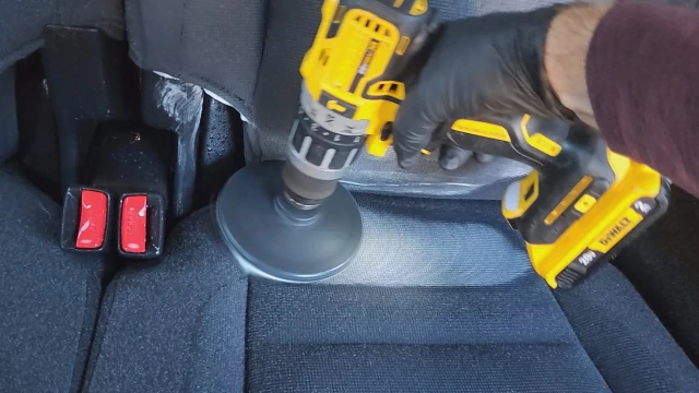 Brushing a fabric seat cleaning